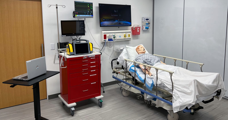 Standardized patient mannequins Advanced adult patient mannequin in a hospital bed in the PCOM South Georgia Simulation Center